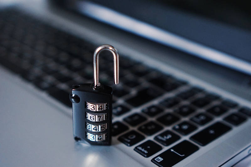 Padlock on laptop keyboard